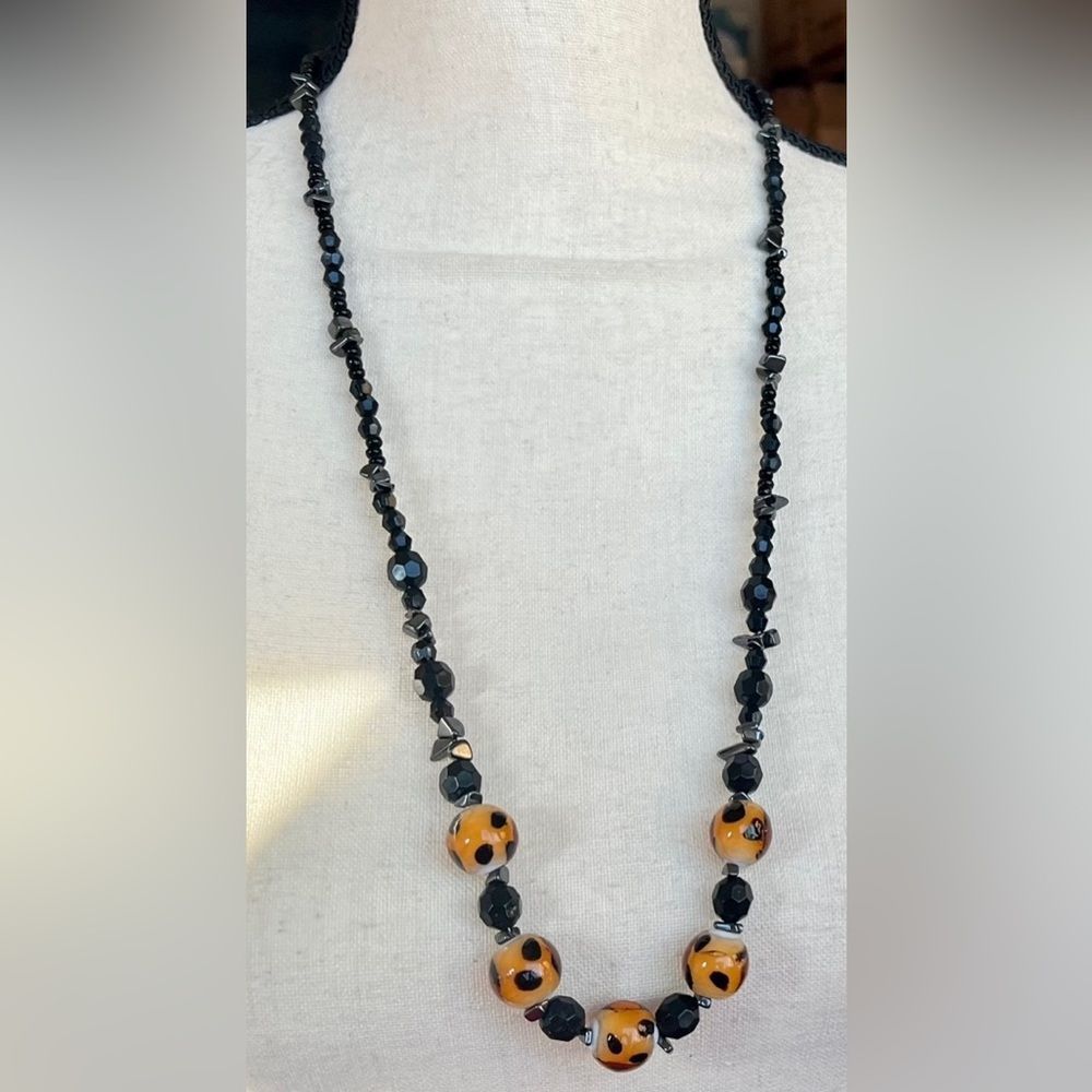 Leopard print glass bead and hematite necklace 29 1/2” + 2 1/2”